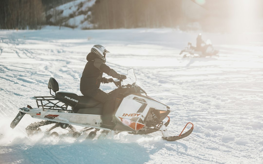 Home person-riding-snowmobile-during-daytime-icaoenvlgag